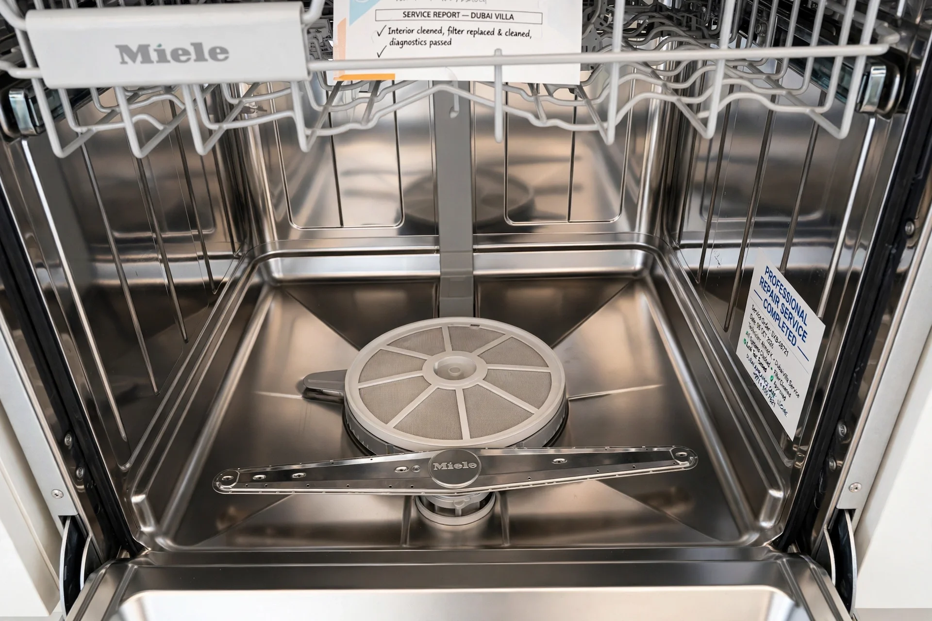 Certified technician testing Miele dishwasher safety and water flow after repair in Dubai